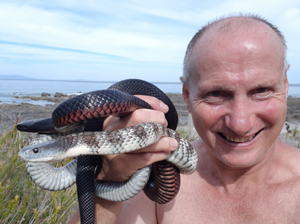 Snake Man with two deadly snakes
